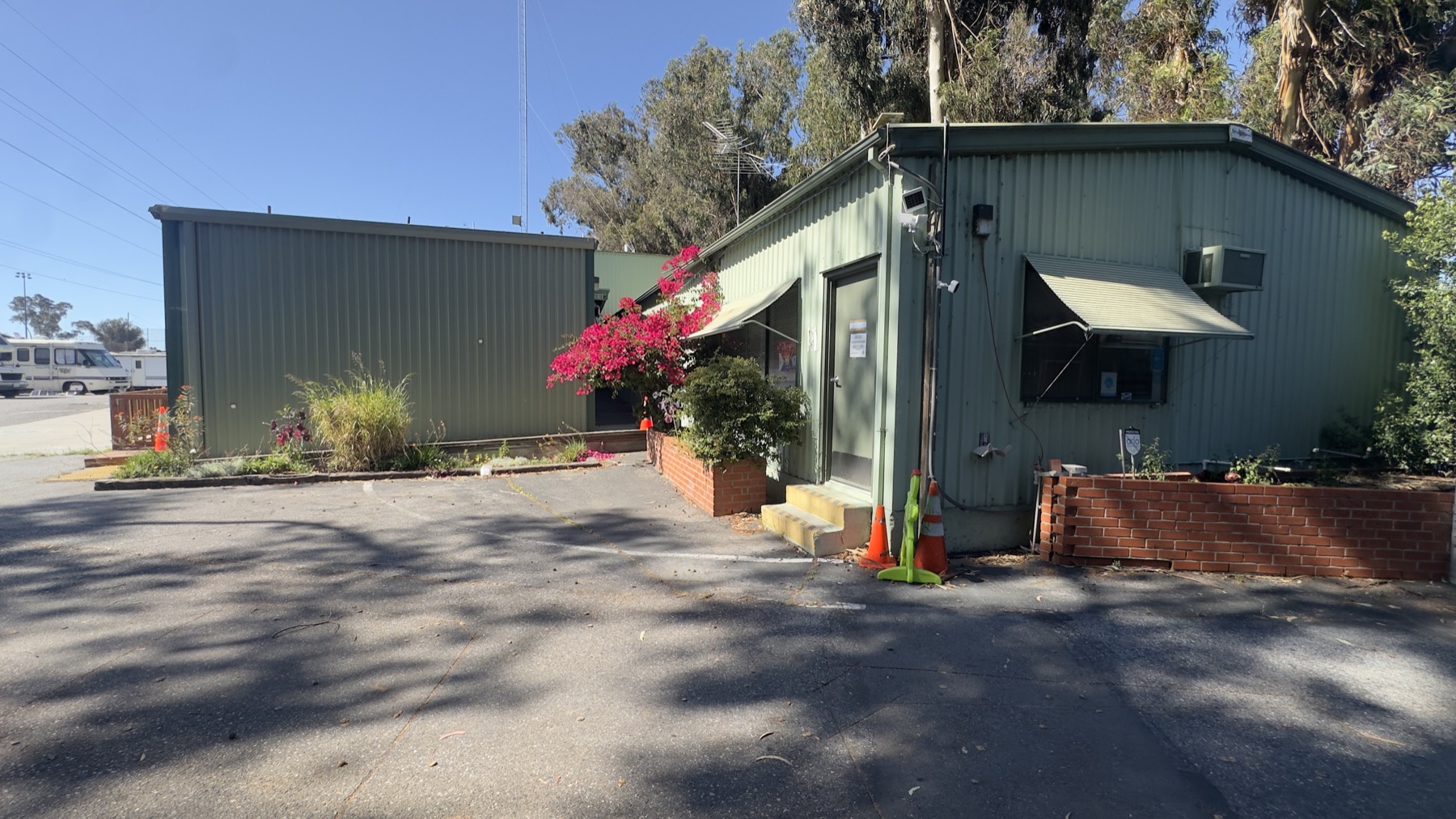 Exterior building and entry area at the Geng safe-parking site on May 13, 2026